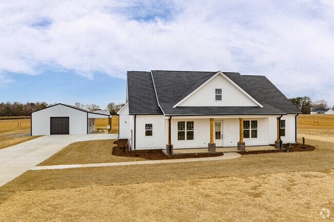 A beautiful large white farm house on a large lot in Cartwright.