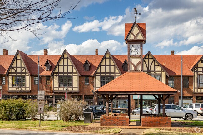 Avondale Estates Downtown Area And Clock Tower Full of Tudor Buildings Hosting Businesses and Restaurants