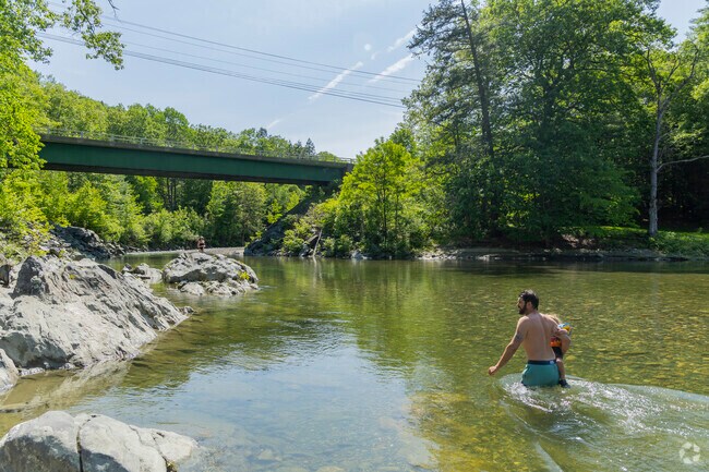 On hot summer days, locals cool off in the West River near Brookline, where clear water and forest shade offer the perfect retreat.
