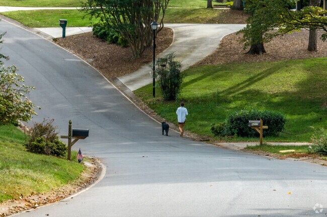 The many shaded roads in Raintree are perfect for long walks with fury friends.