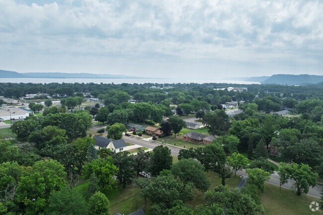 Many of the homes in Lake City are surrounded by large trees.