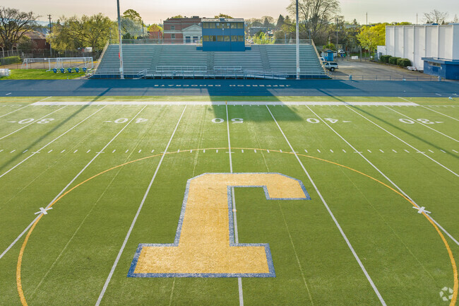 Morning sun stretches down the fifty yard line on the Jefferson Highschool Football Field in the Humboldt Neighborhood.