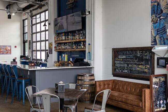 Fusion BBQ features a dining room and bar area in an old industrial building.