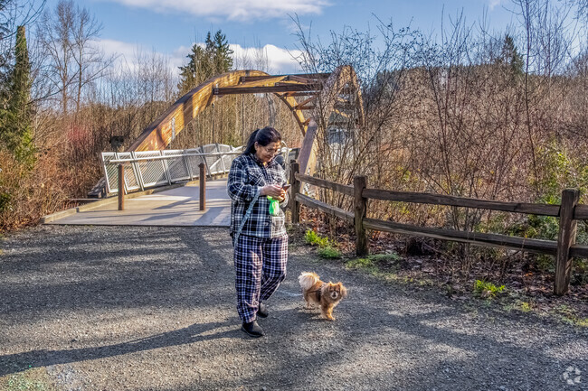 Gilman local walking across the Mayfly Bridge in Confluence Park.