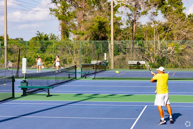 Shadow Bay Park guests can enjoy a game of tennis in a beautiful and natural setting.