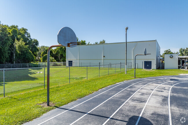 Kids enjoy outdoor play on the sports courts at Inverness Middle School.
