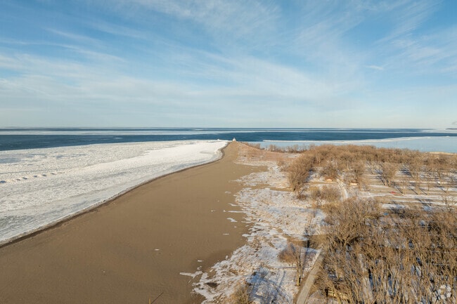 Visitors to Mentor Headlands Beach State Park in Mentor, Ohio enjoy swimming in Lake Erie.