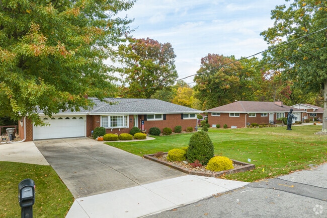 Brick ranch-style homes often feature attached garages in Daugherty Township.