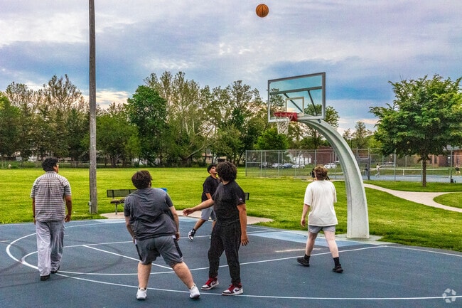The basketball court at Columbus Park draws McKinley School residents in for pick-up games.