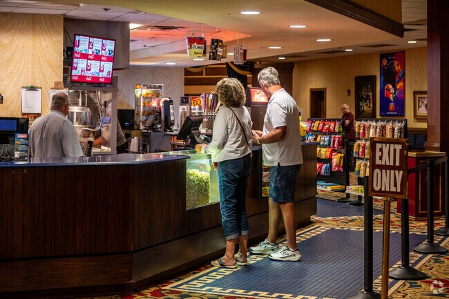 Village of Amelia locals enjoy popcorn and a movie at Old Mill Playhouse.