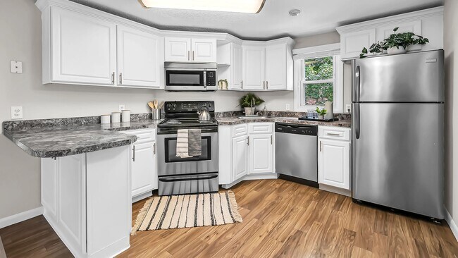 Elegant stainless steel appliances add modern style to our charming kitchens at The Willows.