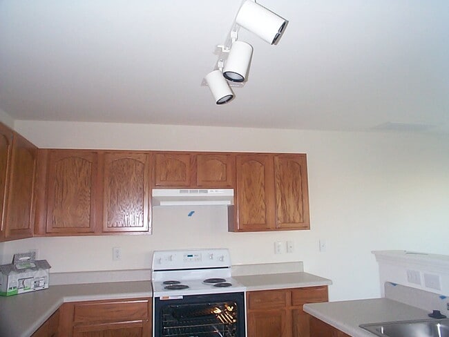 Kitchen Note this pic was taken before the walls were painted and the backsplash was added behind the sink.