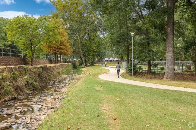 Walk the long paved path around Creekmore Park in Fort Smith.