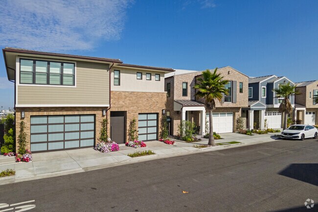 Near the coast you'll find these modern brick veneer homes with frosted glass garage doors.