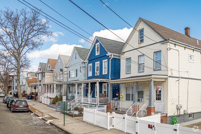 National-style and Cape Cod homes, built in the early 1900s, feature small backyards and tight spacing in Southwestern Perth Amboy.