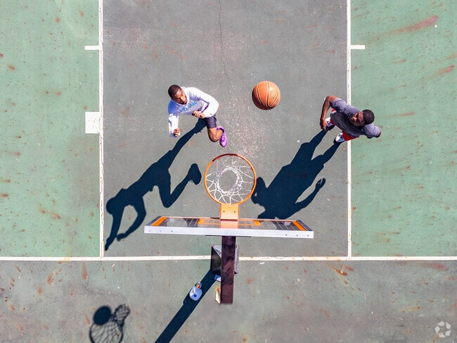 Academy Park offers basketball courts for outdoor recreation.