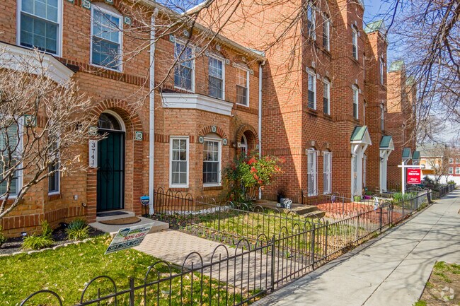 Many homes in Mayfair feature small fenced-in front yards.