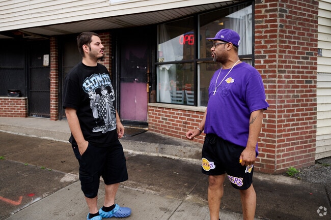 Residents of Upper Falls wait for their takeout orders at Bobo's Chicken Shack in Upper Falls.
