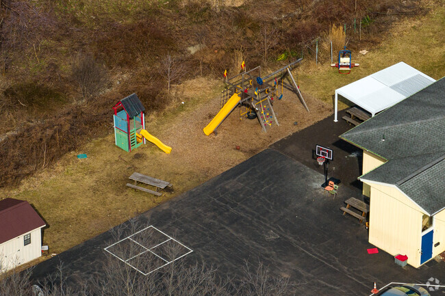 The New School in DeWitt has a small basketball court and playground.