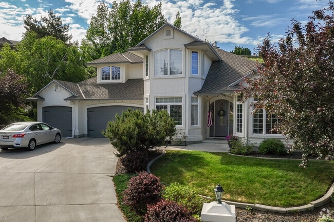 Large picture windows offer scenic vistas of the valley beneath the Foothills.