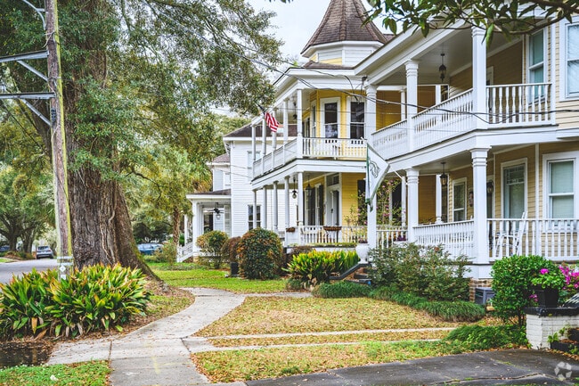 Two story houses in the Washington Square neighborhood feature multiple balconies.