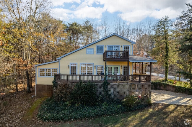 Saltbox style homes are surrounded by trees in Tigerville.