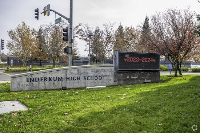 The entrance to Inderkum High School has a modern look with a digital sign.