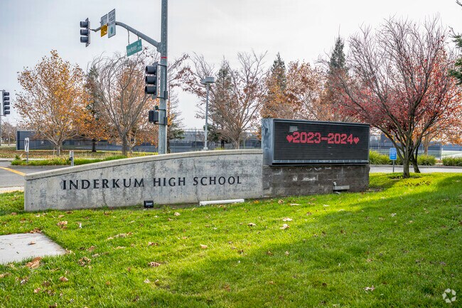 The entrance to Inderkum High School has a modern look with a digital sign.