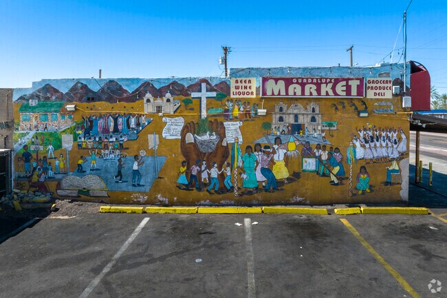 This mural on the Guadalupe Market depicts the sense of community in Guadalupe.