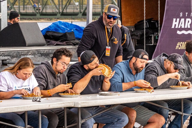 Attendees test their pie eating skills at the Stillwater Harvest Fest.