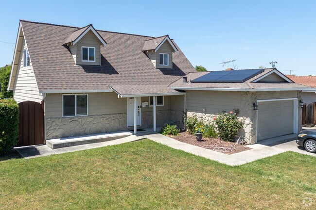A Cape Cod-style home in Morrill features dormer windows and subtle stone accents at the entry.
