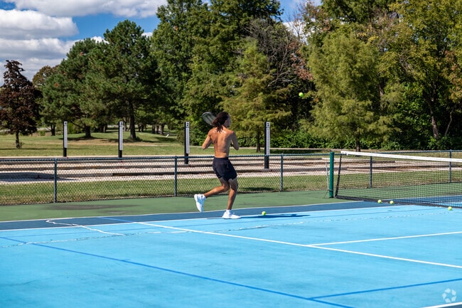 Enjoy a game of tennis at Cosmopolitan Park near West Ash.