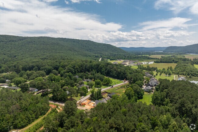 Lush mountains fill the backdrop of this quiet neighborhood.