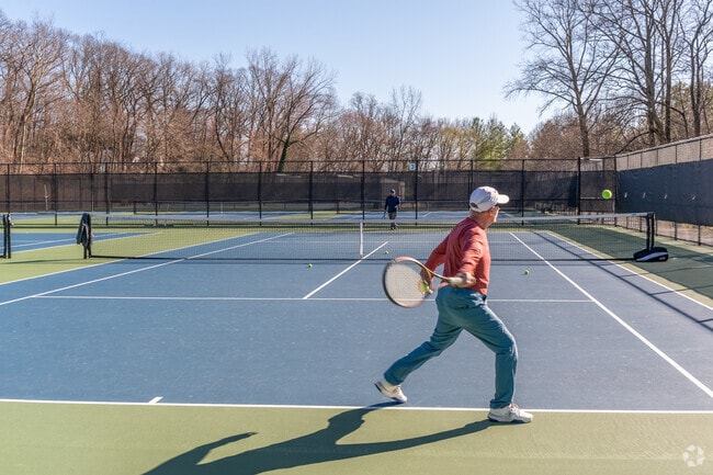 Pinebrook Tennis Center offers 8 tennis courts and 4 pickleball courts.