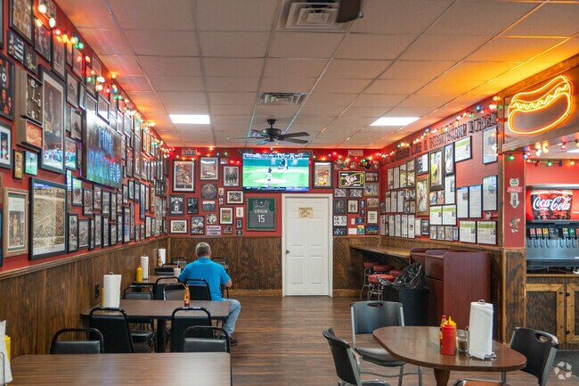 Relax and watch the game with good food at Sol's Hot Dogs in Norwood.