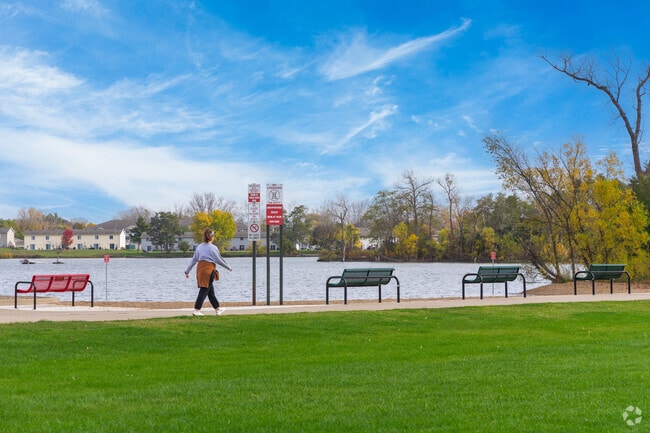 Locals walk on the paved paths around Lake Winona for fresh air and exercise.