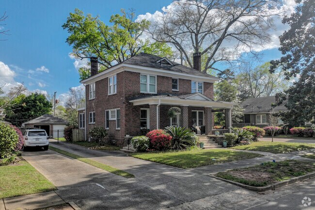 Another stately post-war home sits proudly amongst the trees in Cottonwood.