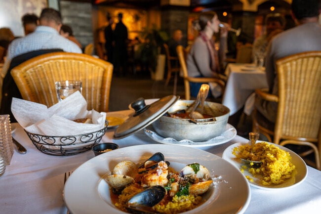 Forest Hills residents take in all the flavors of seafood paella at Spain Restaurant.