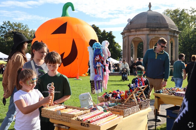 Kids delight in the creative crafts and festive atmosphere at the Haunted Happenings Marketplace.