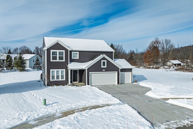 Caledonia Township homes with three-car garages offer space for vehicles and gear.