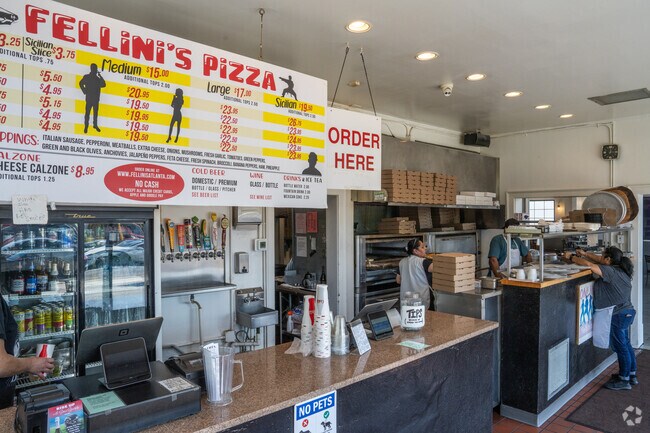 You can order pizza by the slice or the pie at Fellini's Pizza.