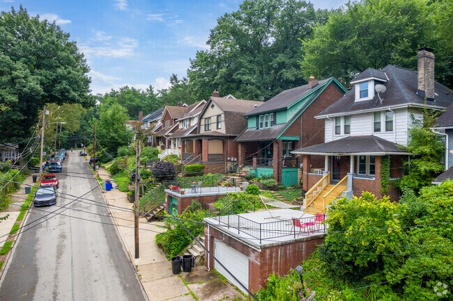 The rolling hills in Edgewood make for homes with large front steps and porches.