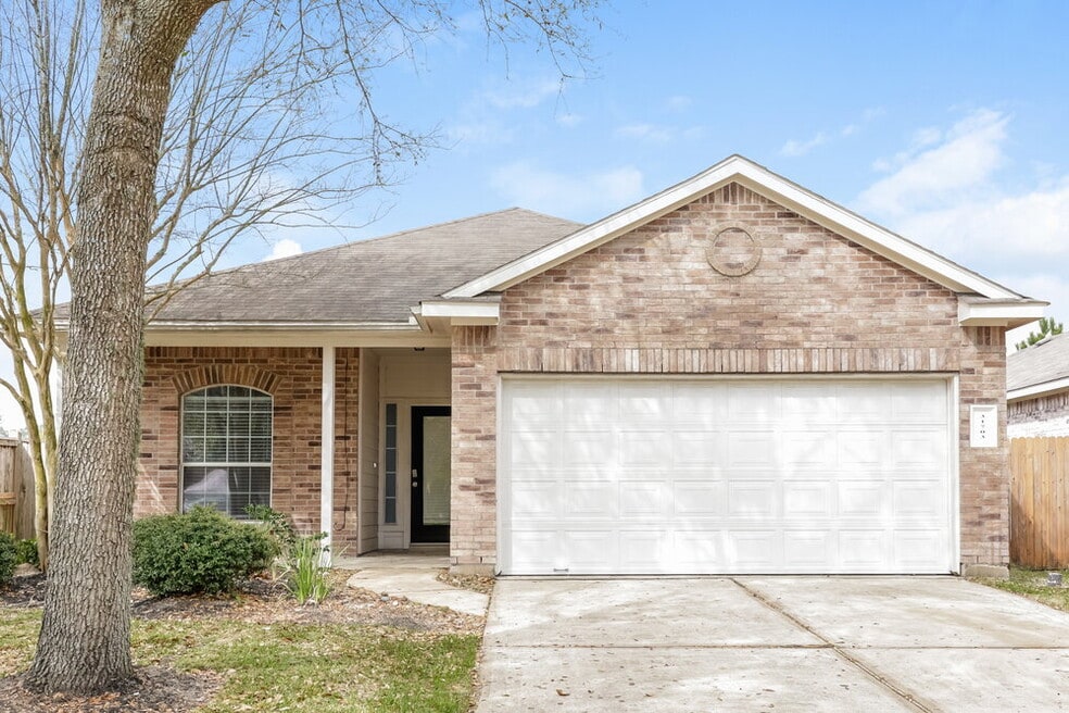 31703 Forest Oak Park Ct, Conroe, TX 77385 - photo 1