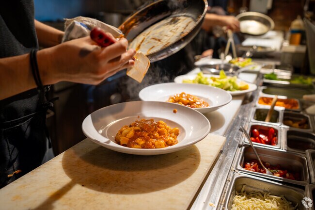 Enjoy a dish of hand-crafted pasta at FiorItally Trattoria nearby to the Lawrence Estates area.