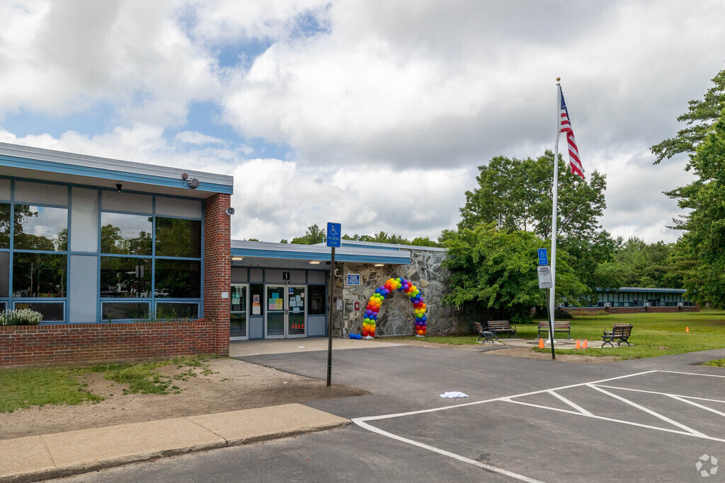A vibrant rainbow arch welcomes students to Hancock Elementary School in Brockton.