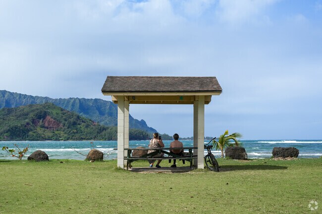 Hanalei's Hanalei Beach Park is a popular spot for picnics, beach volleyball, and gatherings.