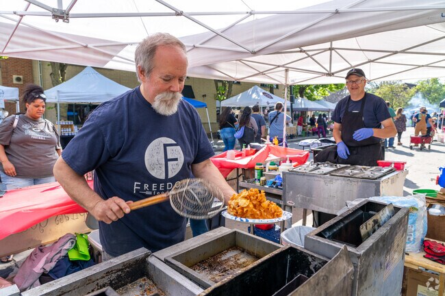 Vendors cook up fresh food for local Fort Howard residents in Green Bay, WI.