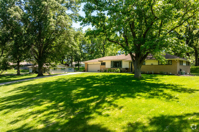There are many different style of homes in Platte woods and many sit on hillsides.