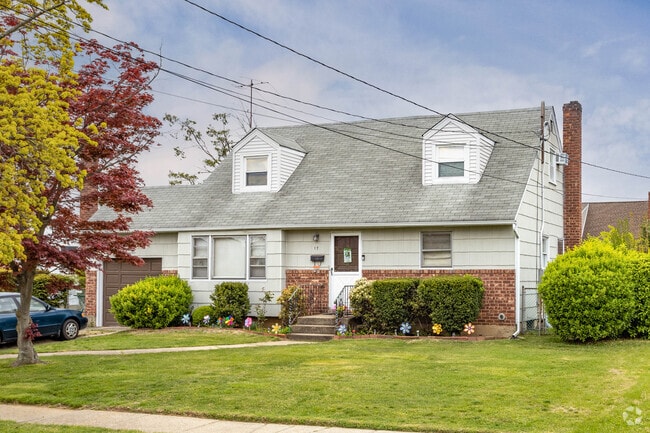 Many Cape Cods in South Farmingdale are dormered and have well maintained front lawns.