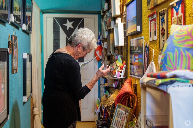 A shopper admires the artwork at Casa Del Artesan in Downtown Kissimmee.